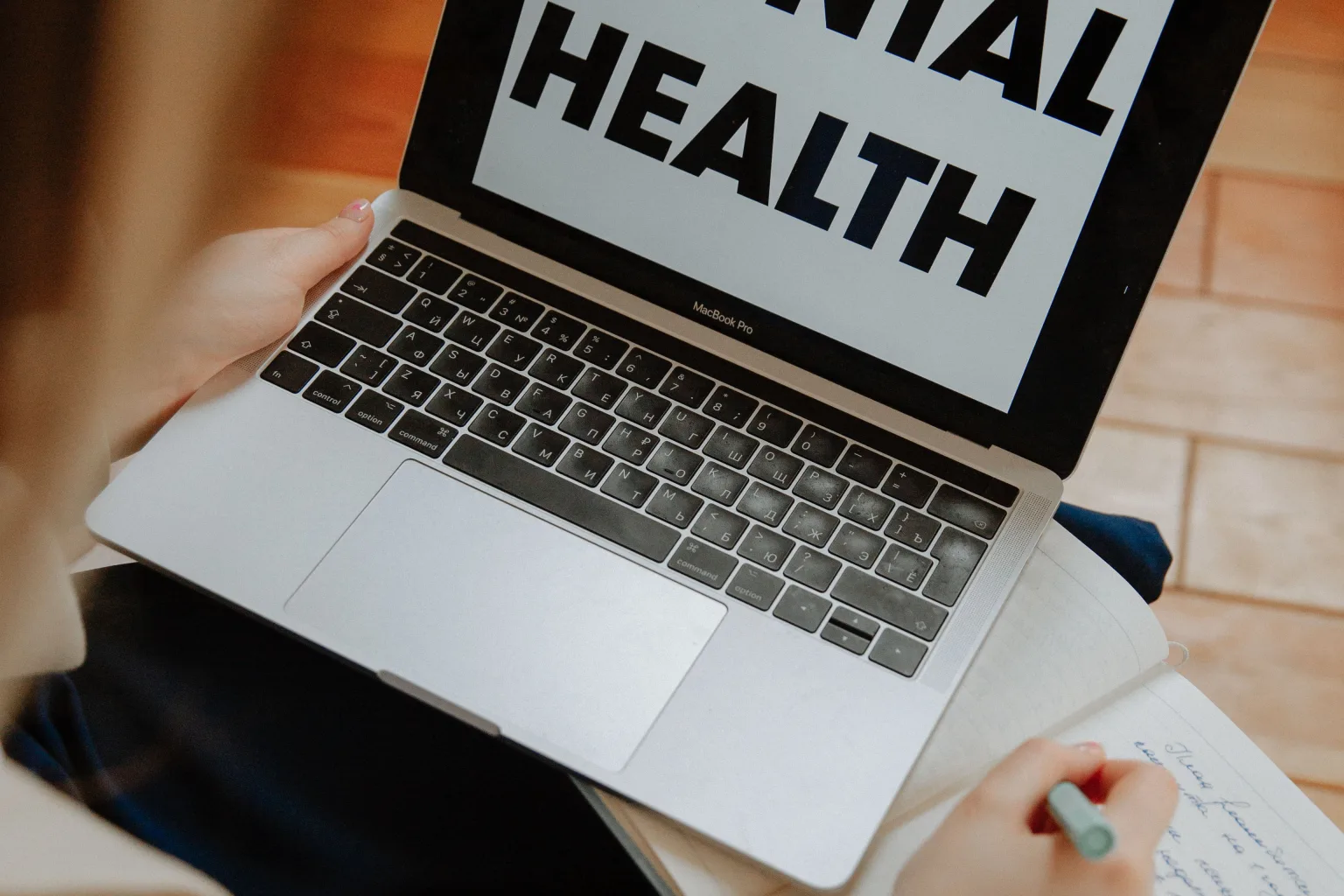 Person using a laptop during a virtual mental health appointment in North Carolina